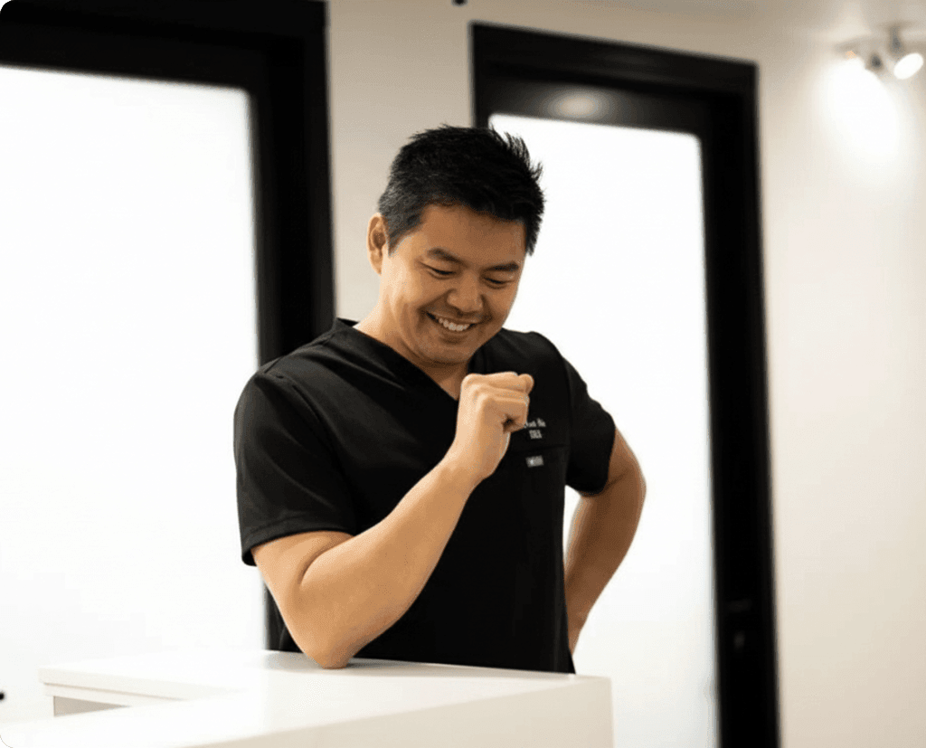 Man looking at his teeth in a mirror