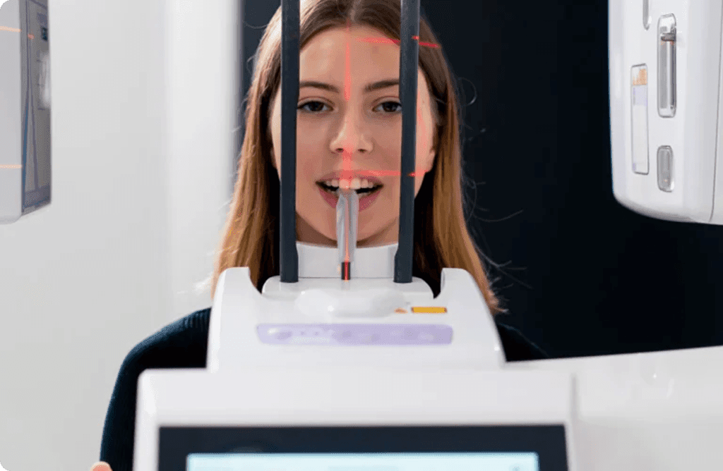 Patient having a tooth shade assessment in the dental chair